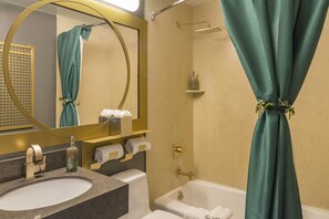 Combined shower/bathtub, designer toiletries, hair dryer, towels
