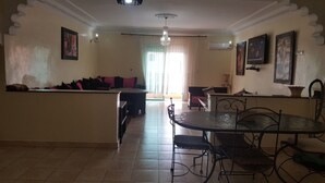 Exclusive Apartment, 2 Bedrooms | Living area | 50-inch flat-screen TV with cable channels, TV - Appartement 1 Résidence Manis Marrakech (Marrakech)
