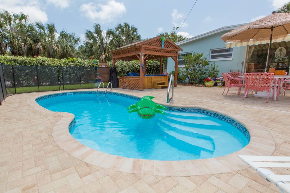 The Cabana Spa & Beach House is located directly across the street from the beach. Walk through your own private entrance to the beach. This allows families who travel together to still have privacy and yet be together at the same time. It\'s perfect for grand parents, in-laws, honeymooners, or families looking for a wonderful getaway. The house is fully furnished with all linens and kitchen utensils...just bring your bathing suit!<br>This property is located in the quiet, exclusive Clearwater Beach neighborhood. You will be within walking distance or the Jolly Trolley that runs every 30 minutes up Mandalay avenue and along the beach to the famous Pier 60, restaurants, bars and shopping, dinner cruises, boat rides, dolphin encounter tours, deep sea fishing and much more.<br><br>Beautiful sunsets await you on Sunset Beach. Walk out your back door to a private gate that leads to one of the most beautiful beaches in the world. Walk barefoot in the soft white sand and swim in the warm Gulf waters. Clearwater Beach was recently rated in the top 5 best beaches in the state of Florida by cable TV\'s Travel Channel.<br> SALE Oct 29-Nov 5 $1800 Small Dog OK. Beach, Pool - 20 Secs to Sand!