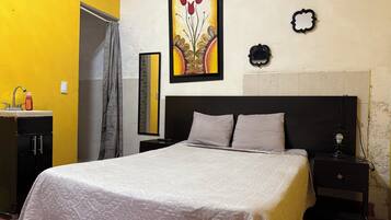 Economy Room | Iron/ironing board (on request), WiFi (free), bed sheets