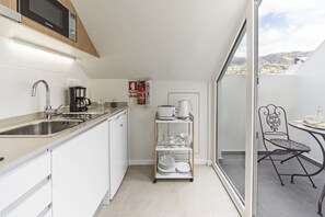 Fridge, microwave, stovetop, coffee/tea maker