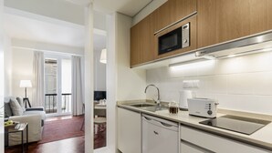 A modern kitchen with a built-in microwave, a toaster, and a dishwasher. - Downtown Funchal Apartments 2C 25 Fontes. (Funchal)