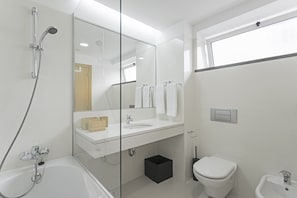 Bathtub, hair dryer, towels