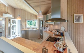 Fridge, stovetop, dishwasher, coffee/tea maker