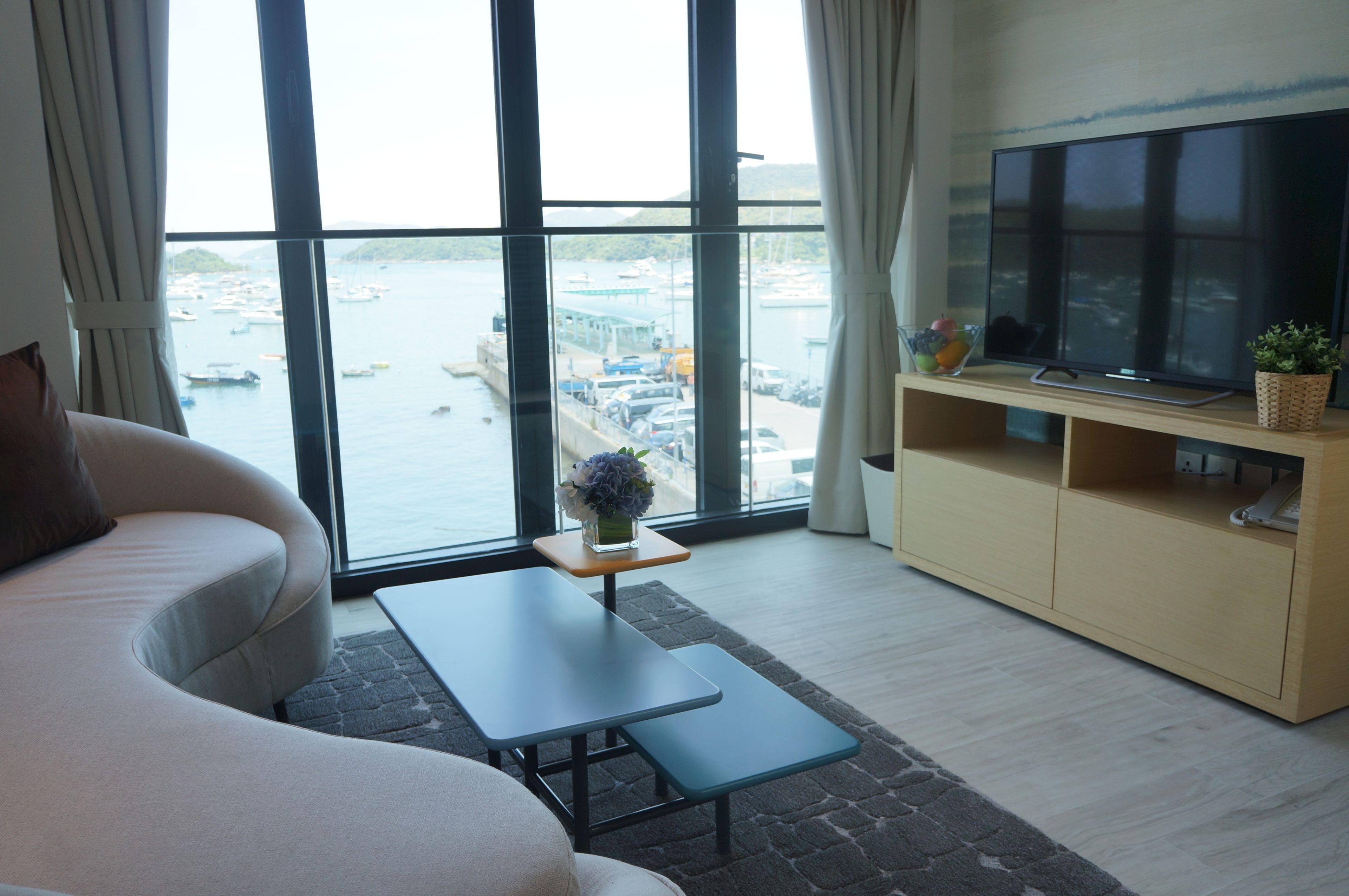 luxury suite, 1 bedroom, ocean view | living room | flat-screen tv