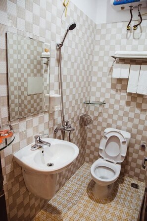 Shower, free toiletries, hair dryer, slippers