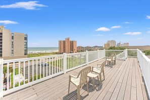 A balcony with a view of the beach and cityscape. - Luxurious private beach house with private pool + Free Attraction Tickets! (North Myrtle Beach)