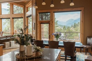 Enjoy a meal for two at the dining table, then relax in the comfortable seating area with a sofa and chairs.