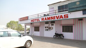A building with a sign reading "HOTEL RAMNIVAS."