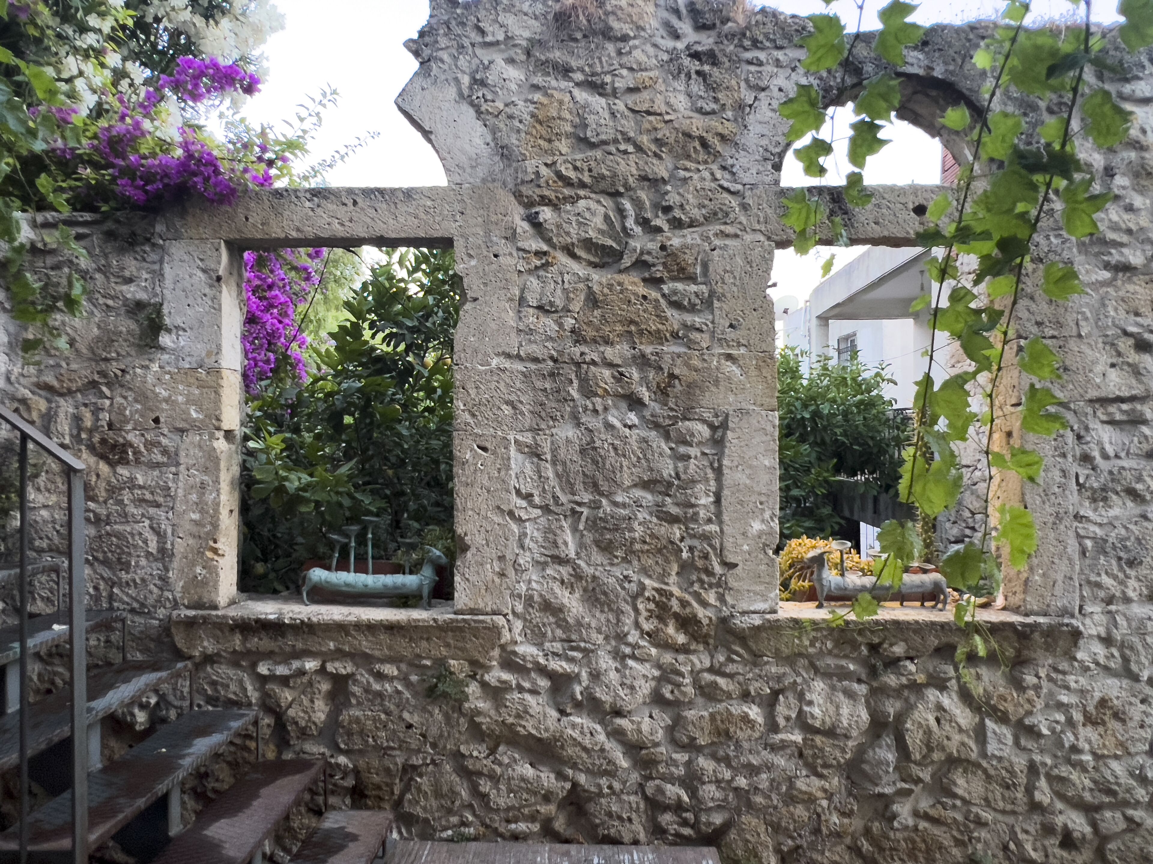 A stone structure with a window and a staircase.