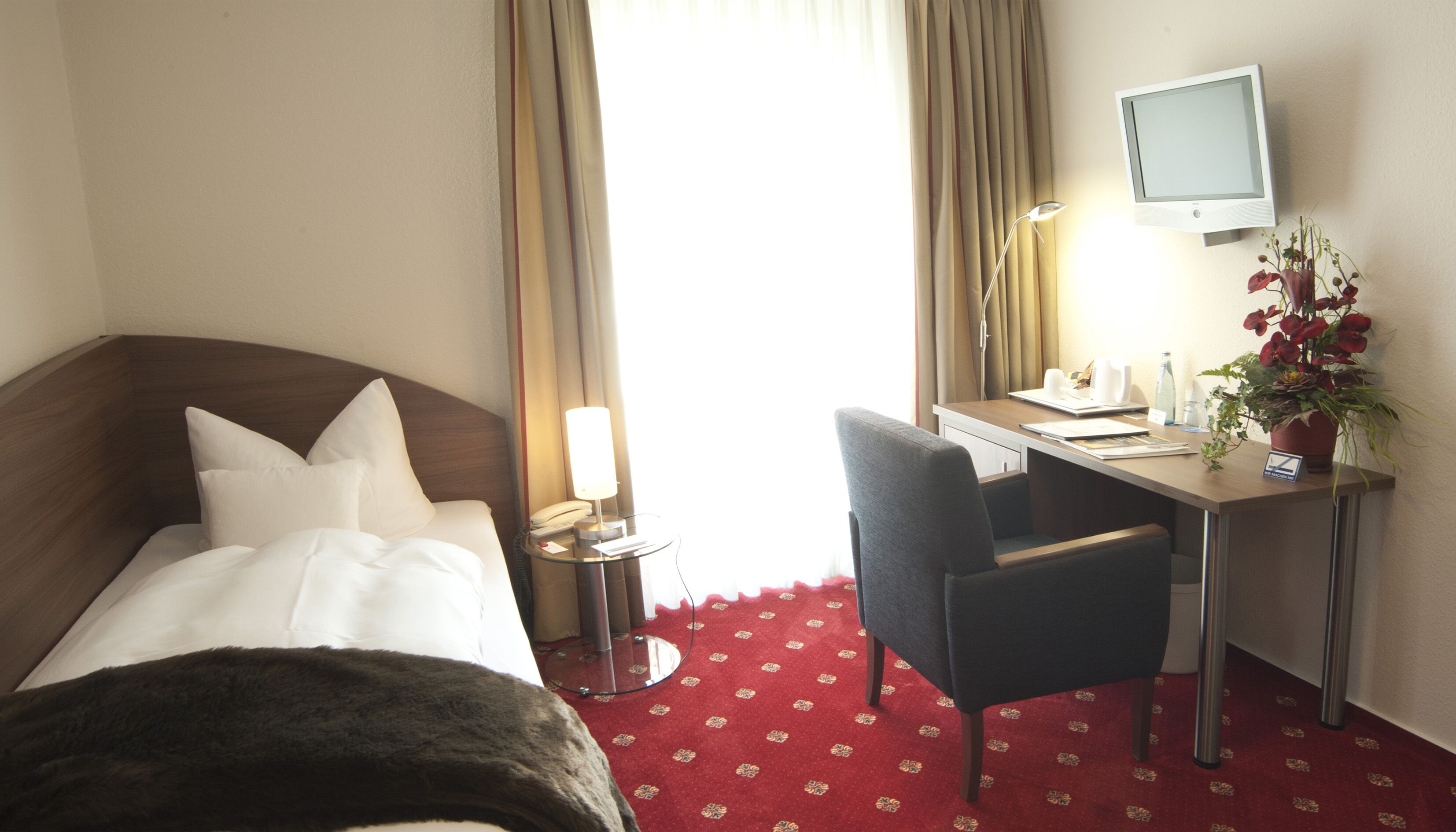 single room | living area | flat-screen tv