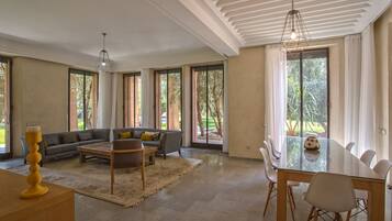 Luxury Villa (4 Suites Luxe) | Living room | 42-inch flat-screen TV with cable channels, TV