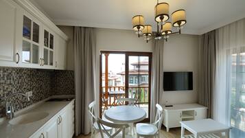Apartment, Garden View | Living area | LCD TV