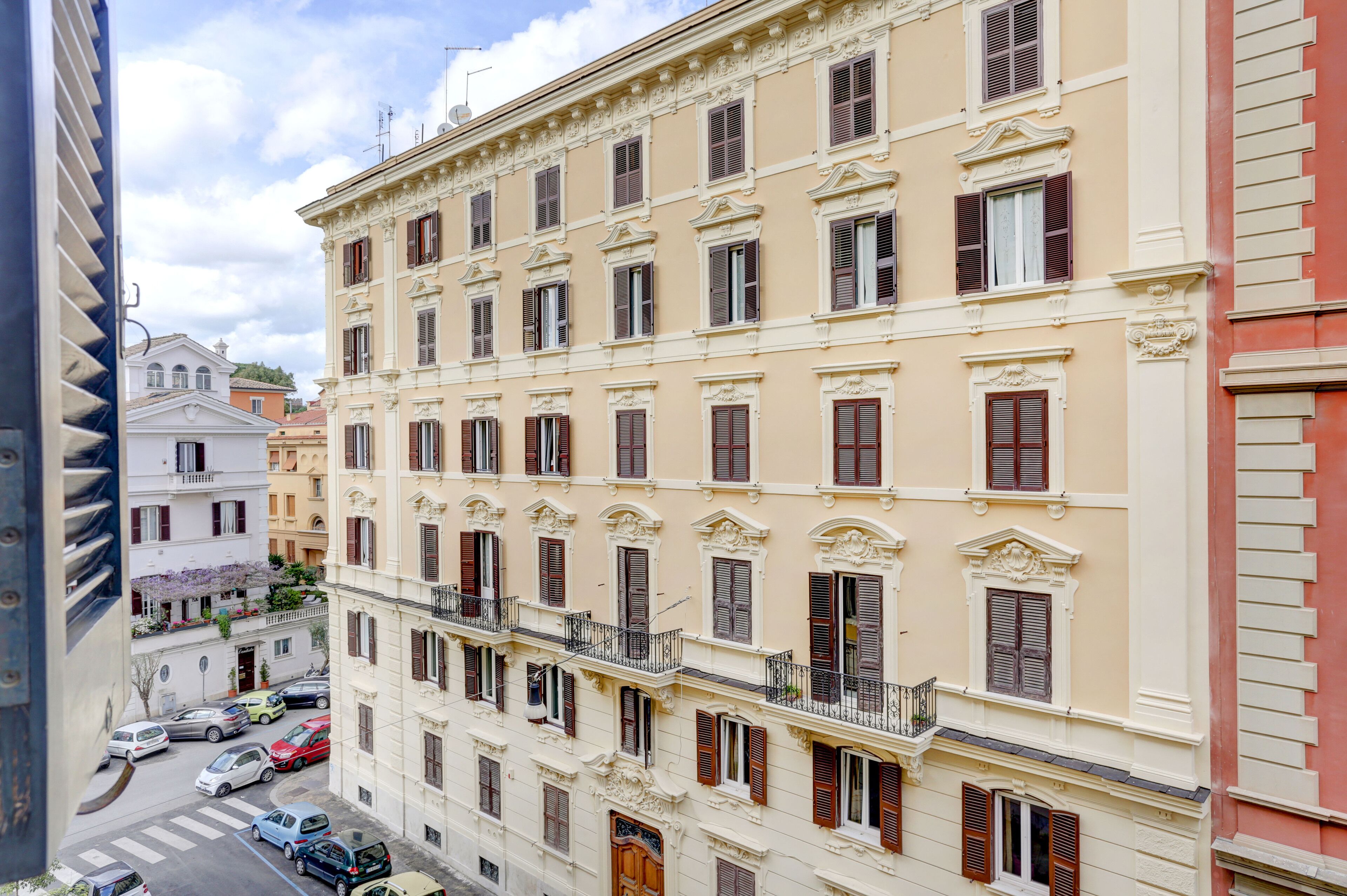 A multi-story building with a classic architectural style, featuring evenly spaced windows and balconies.