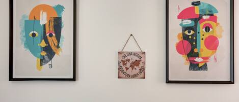 Two framed abstract artworks on a wall.