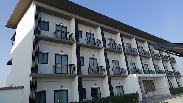 A multi-story building with balconies, large windows, and a flat roof. - The Zen Hotel Yasothon (Yasothon)