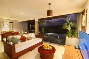 Ayuterra Two Bedrooms Villa | Living room | 42-inch flat-screen TV with satellite channels, TV - Ayuterra Resort (Ubud)