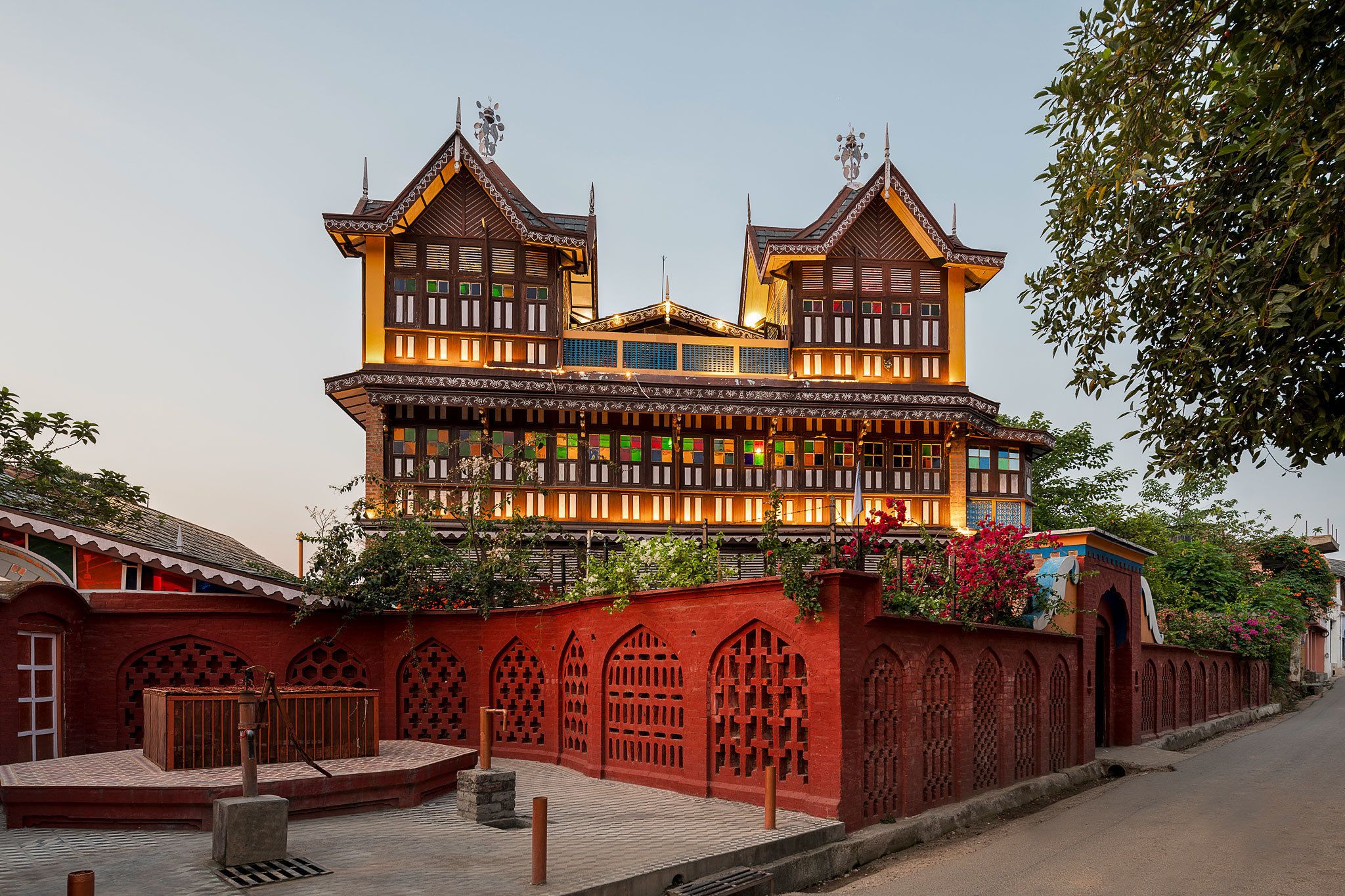A traditional building with multiple levels and ornate wooden balconies.