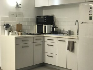 Design Apartment, 1 Bedroom | Private kitchen | Full-size fridge, microwave, oven, stovetop