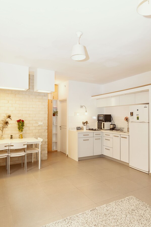 Departamento de diseñador, 1 habitación | Área de sala de estar | Televisión de pantalla plana 