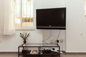 Design Apartment, 1 Bedroom | Living area | Flat-screen TV