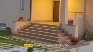 A house with a red-tiled roof, a covered porch with steps, and a door leading inside. - Villa Lauro Luxury B&B (Castellabate)