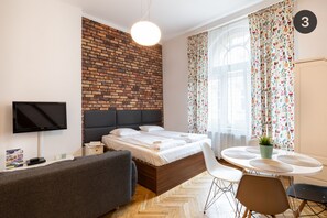 Studio Suite, Mezzanine | Iron/ironing board, free cribs/infant beds, free WiFi, bed sheets
