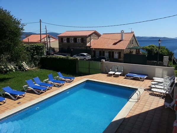 Outdoor pool, pool umbrellas, pool loungers