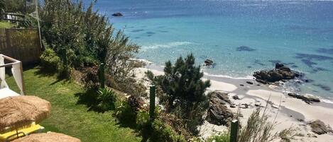 On the beach, sun-loungers
