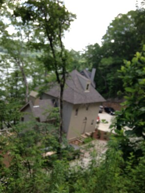A house surrounded by trees. - Exclusive Smith Lake Slice of Heaven  in the Gated Point William Development.  (Crane Hill)