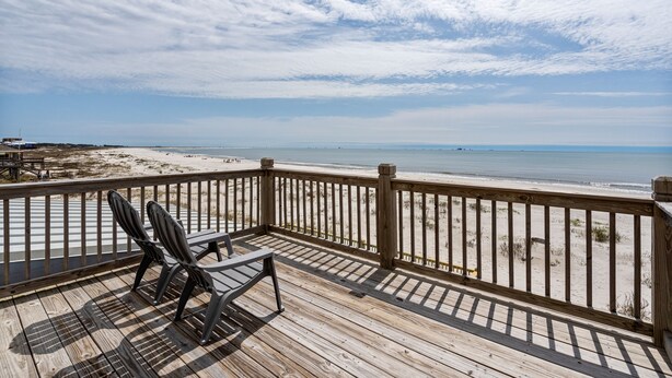A wooden deck with a view of the beach and ocean. - Gulf Front Home with 3 Master Bedrooms (Dauphin Island)