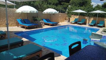 Outdoor pool, open 8 AM to 9 PM, pool umbrellas, sun loungers