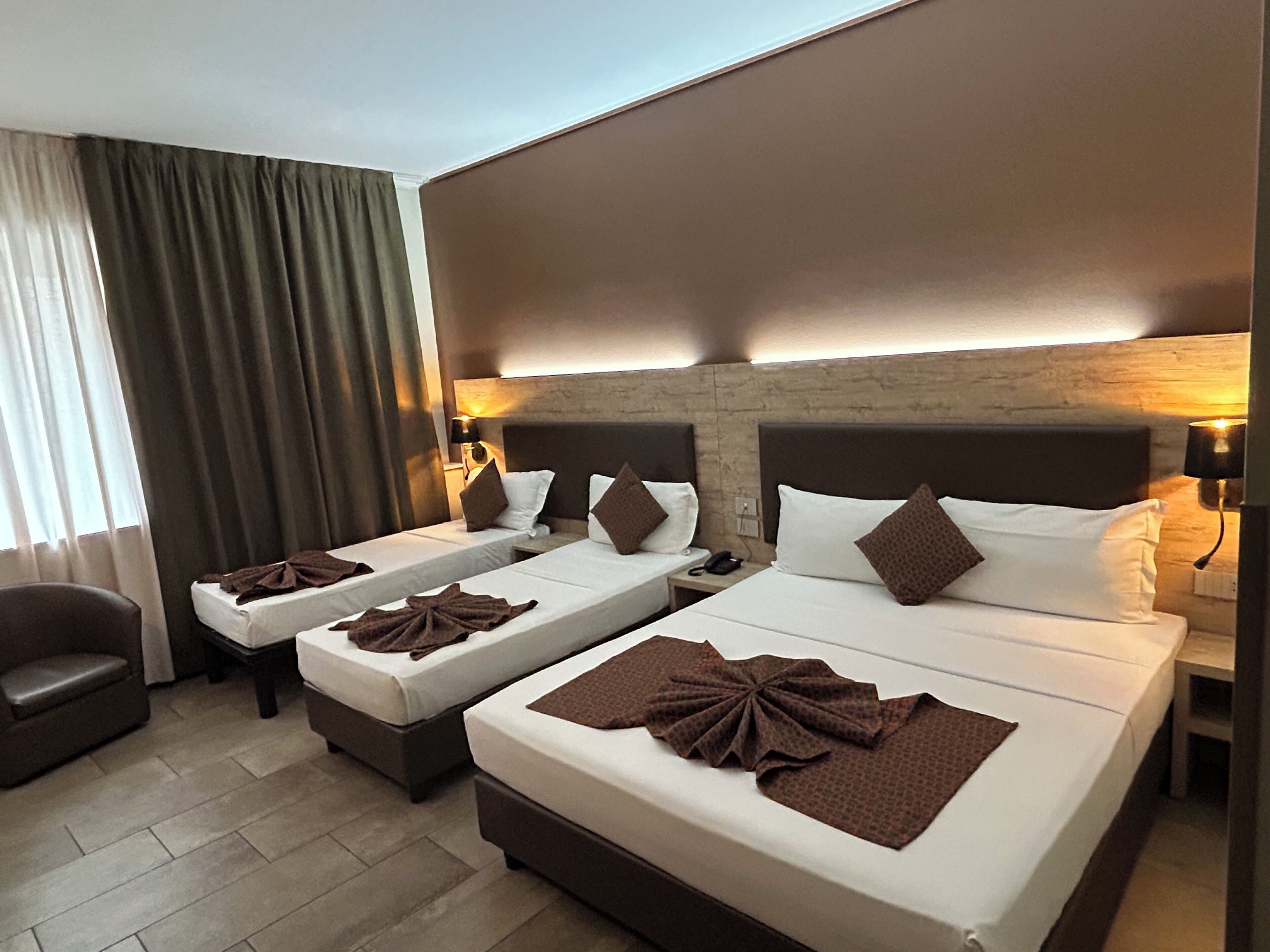 Standard Quadruple Room, Non Smoking | Down comforters, in-room safe, individually furnished, desk