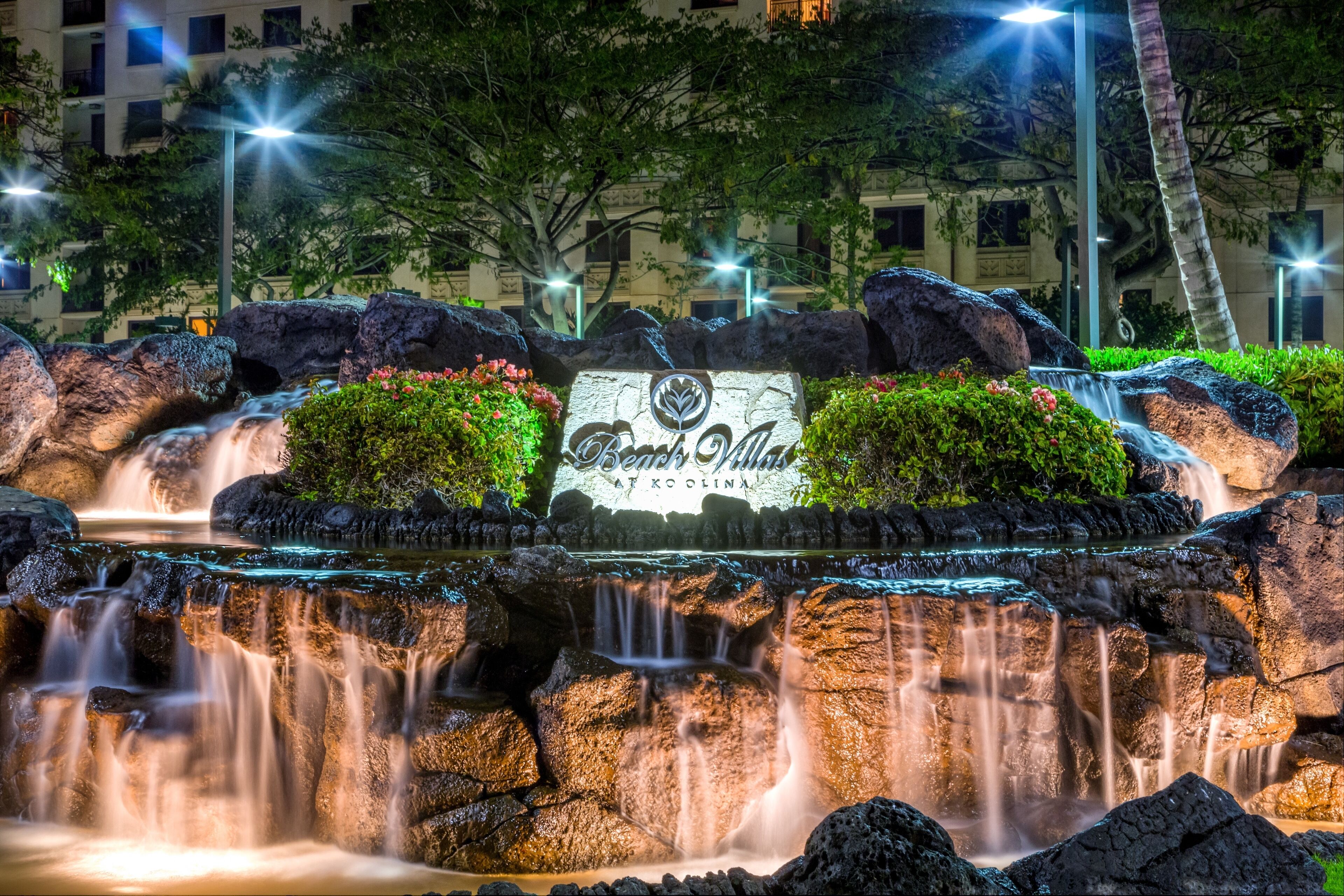 A waterfall feature with a sign reading "Beach Villa."