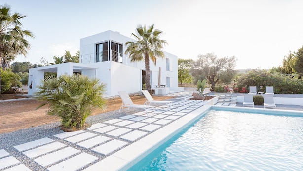 A modern white villa with a swimming pool, surrounded by palm trees and a garden. - Modern Villa with pool close to IBIZA. (IBIZA)
