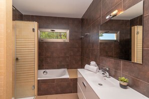 Bathtub, hair dryer, towels