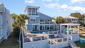 A two-story house with a large deck and a swimming pool. - Lake Front w/ Dock, Kayaks and Pool (Santa Rosa Beach)