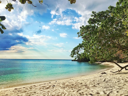 Lovely modern home overlooking the Caribbean Sea and only steps from the beach