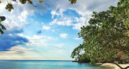 Lovely modern home overlooking the Caribbean Sea and only steps from the beach