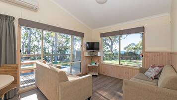 Cabin, 2 Bedrooms, Partial Ocean View (Mariner) | Living room | Flat-screen TV, DVD player