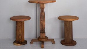 Three wooden tables of varying heights against a plain wall. - Triple Tree Resort (Lam Luk Ka)