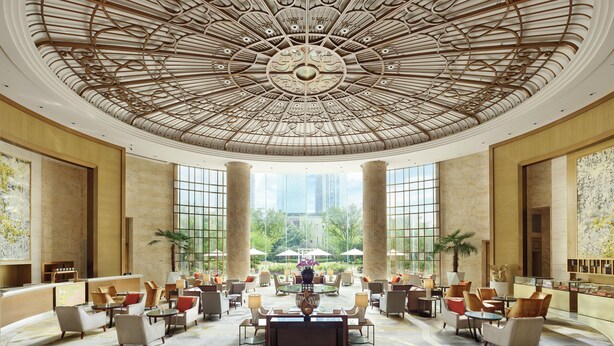 A spacious lobby with a high ceiling, large windows, and a central seating area. - The Langham, Hefei (Hefei)
