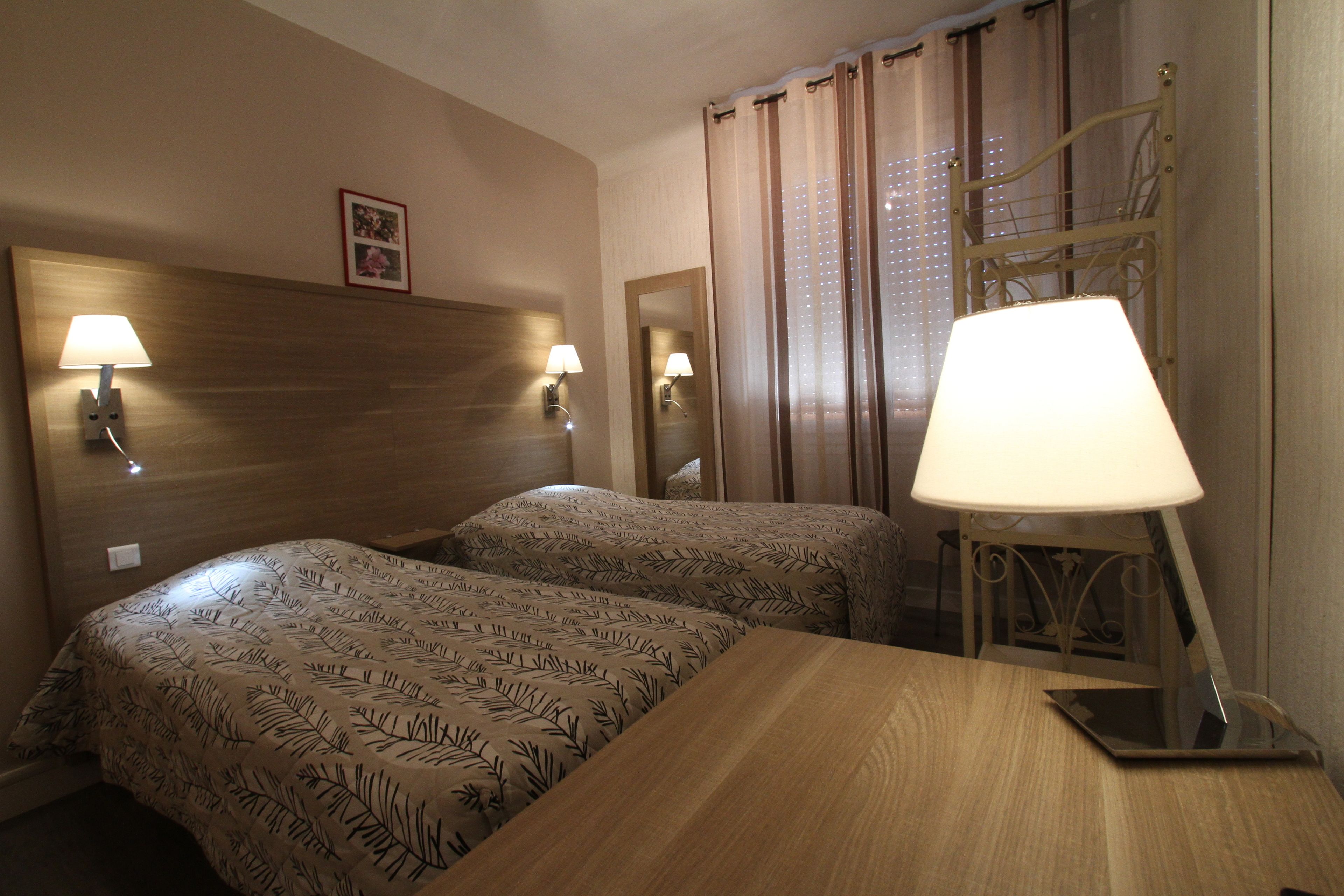 twin room | individually decorated, individually furnished, desk, blackout curtains