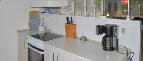 Fridge, stovetop, dishwasher, coffee/tea maker