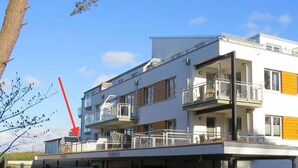 A modern multi-story building with balconies, large windows, and a flat roof. - Traumsegler, Germany (Breege)