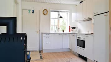 Fridge, stovetop, dishwasher, coffee/tea maker