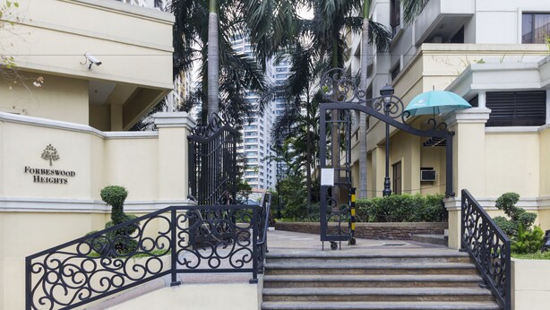 A set of stairs leading to a building entrance with a sign reading "Forbeswood Heights." - Forbeswood Heights near St Lukes (Taguig)