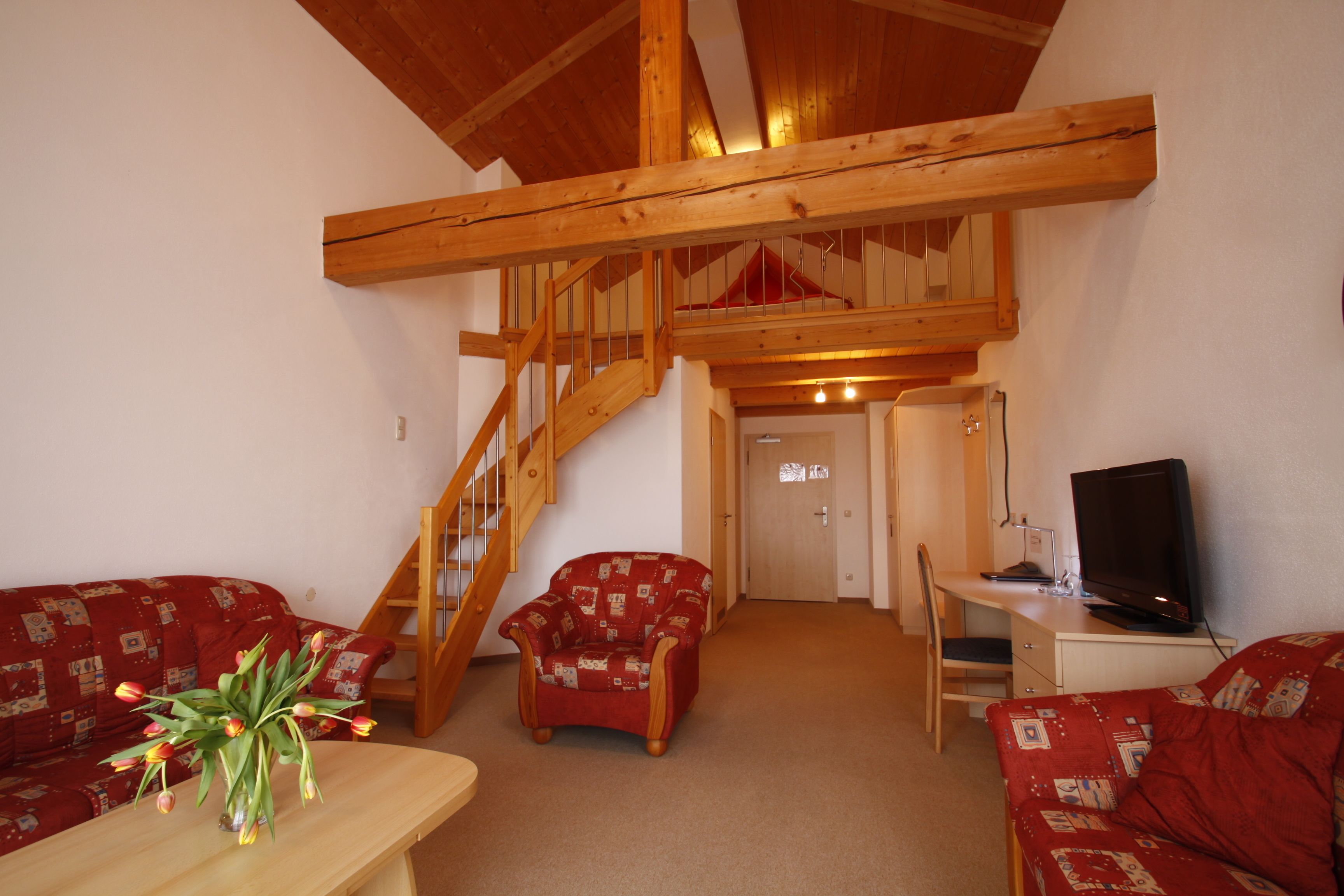 comfort double room | living area | flat-screen tv