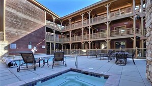 A pool area with lounge chairs and a hot tub. - Private Hot tub & BBQ, Shuttle! Luxury Amenities & walk to lifts (Deer Valley)