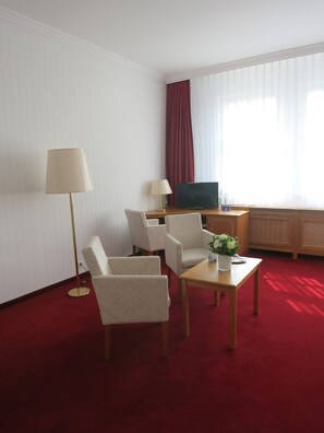 Quarto casal | Área de estar | TV de tela plana